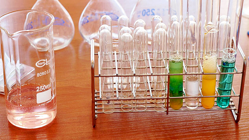 Beakers and test tubes on bench in lab